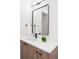 Stylish bathroom featuring modern fixtures, a sleek mirror, and a bright white countertop basin at 716 S Race St, Denver, CO 80209