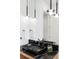Modern bathroom boasts a sleek black sink and contemporary lighting at 716 S Race St, Denver, CO 80209