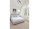 Bright bedroom with large windows, modern light fixture and a comfortable upholstered bed with neutral bedding at 716 S Race St, Denver, CO 80209