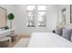 Bright bedroom featuring large windows, neutral tones, and modern decor creating a serene atmosphere at 716 S Race St, Denver, CO 80209