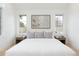 Inviting bedroom with large windows, plush bedding, neutral color palette, and modern decor at 716 S Race St, Denver, CO 80209