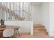 Bright dining area with wooden table, stylish chairs and staircase with unique banister design at 716 S Race St, Denver, CO 80209