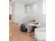 Bright hallway with wood flooring, soft seating area, modern decor and natural light at 716 S Race St, Denver, CO 80209