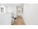 Bright hallway with wood flooring, soft seating area, modern decor and natural light at 716 S Race St, Denver, CO 80209