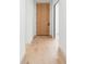 Clean hallway features light hardwood floors and contemporary design at 716 S Race St, Denver, CO 80209