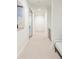 Bright hallway features neutral carpet, white walls, and recessed lighting, with a bench to the right at 716 S Race St, Denver, CO 80209