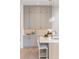 This modern kitchen has a beautiful backsplash, ample cabinet space and sleek countertops at 716 S Race St, Denver, CO 80209