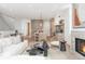 Open-concept living space that connects to the kitchen; fireplace and stylish decor throughout at 716 S Race St, Denver, CO 80209