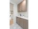 Mudroom with gray wood grain cabinets, quartz countertop, fun patterned flooring and convenient sink at 716 S Race St, Denver, CO 80209