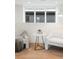 Comfortable sitting area with neutral armchairs, decorative side table and views of the backyard at 716 S Race St, Denver, CO 80209