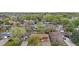 Aerial view of brick house, with a brown roof, neighborhood, and green foliage at 258 S 14Th Ave, Brighton, CO 80601