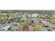 Aerial view of neighborhood with foliage, street, school, and rooftops at 258 S 14Th Ave, Brighton, CO 80601