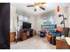 Bedroom with carpet, ceiling fan, natural light from the window, and TV at 258 S 14Th Ave, Brighton, CO 80601