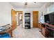 Bedroom with carpet and neutral walls, featuring multiple access doors at 258 S 14Th Ave, Brighton, CO 80601