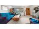 Comfortable living room with a large window, carpet flooring, and a ceiling fan at 258 S 14Th Ave, Brighton, CO 80601