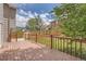 Spacious backyard featuring a wooden deck, lush lawn, and a classic wooden fence at 4037 S Odessa Cir, Aurora, CO 80013