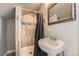 Compact bathroom with tiled shower and modern fixtures, maximizing space and functionality for everyday use at 4037 S Odessa Cir, Aurora, CO 80013
