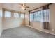 Spacious bedroom with multiple windows, soft carpet, and ample natural light, creating a welcoming atmosphere at 4037 S Odessa Cir, Aurora, CO 80013