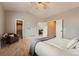 Bright bedroom with neutral tones, a comfortable chair and a walk in closet offering a relaxing space at 4037 S Odessa Cir, Aurora, CO 80013