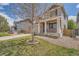 Charming two-story home with a well-maintained lawn, front porch, and welcoming curb appeal at 4037 S Odessa Cir, Aurora, CO 80013