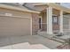Close-up view of the house entrance highlighting the front door, brickwork, and two-car garage at 4037 S Odessa Cir, Aurora, CO 80013