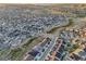 Wide aerial shot of a community with various homes, streets, and green areas at 5029 Silver Hare Ct, Castle Rock, CO 80104