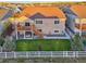 Aerial view of a home with a large backyard, patio, and white fence at 5029 Silver Hare Ct, Castle Rock, CO 80104