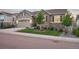 Charming home with stone accents, landscaped lawn, and a two-car garage at 5029 Silver Hare Ct, Castle Rock, CO 80104
