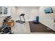 Home gym area with exercise equipment, a treadmill, and natural light for a bright and healthy workout space at 5029 Silver Hare Ct, Castle Rock, CO 80104
