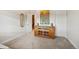 Hallway featuring a storage console and a painting on the wall with neutral carpeting and white doors at 5029 Silver Hare Ct, Castle Rock, CO 80104