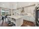 Modern kitchen featuring white cabinets, a large island, and stainless steel appliances at 5029 Silver Hare Ct, Castle Rock, CO 80104