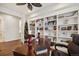 Spacious office with custom built-in bookshelves and hardwood floors at 5029 Silver Hare Ct, Castle Rock, CO 80104