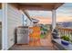 Covered patio with grill and view of the backyard and landscape at 5029 Silver Hare Ct, Castle Rock, CO 80104