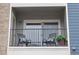 Cozy balcony with comfortable seating and a view, perfect for relaxing outdoors at 4451 S Ammons St # 4-203, Littleton, CO 80123