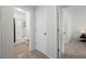 Bright bathroom featuring a shower-tub combo and tile surround at 4451 S Ammons St # 4-203, Littleton, CO 80123