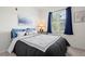 Bedroom with a large window providing natural light and black-out curtains at 4451 S Ammons St # 4-203, Littleton, CO 80123