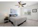 Bedroom features a large window, ceiling fan, and comfortable sleeping space at 4451 S Ammons St # 4-203, Littleton, CO 80123