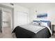 Carpeted bedroom with a double bed, bedside table and closet at 4451 S Ammons St # 4-203, Littleton, CO 80123