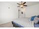 This bedroom features a ceiling fan and neutral walls and carpet at 4451 S Ammons St # 4-203, Littleton, CO 80123