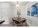 Dining area featuring a modern chandelier and contemporary art at 4451 S Ammons St # 4-203, Littleton, CO 80123