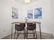 Dining area featuring table with seating for four and modern artwork at 4451 S Ammons St # 4-203, Littleton, CO 80123