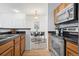 A view from kitchen to the dining room with a table, chairs and decorations at 4451 S Ammons St # 4-203, Littleton, CO 80123