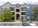 Apartment building displaying multiple balconies, showcasing outdoor living spaces for residents at 4451 S Ammons St # 4-203, Littleton, CO 80123
