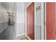 Apartment hallway showing entrance door #201, and corridor, providing building access at 4451 S Ammons St # 4-203, Littleton, CO 80123