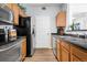 Kitchen with stainless steel appliances and laminate flooring at 4451 S Ammons St # 4-203, Littleton, CO 80123