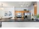 A view of kitchen with stainless steel appliances and wooden cabinets at 4451 S Ammons St # 4-203, Littleton, CO 80123
