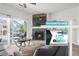 A cozy living room with a fireplace and a sliding door to a balcony in this condo at 4451 S Ammons St # 4-203, Littleton, CO 80123