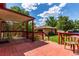 Back deck with a view of the yard and a detached garage at 10841 Montview Blvd, Aurora, CO 80010