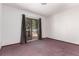 Bright bedroom with a sliding glass door leading to a porch, providing an indoor-outdoor living experience at 10841 Montview Blvd, Aurora, CO 80010