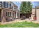 Brick patio with outdoor seating and lush green lawn at 350 Albion St, Denver, CO 80220